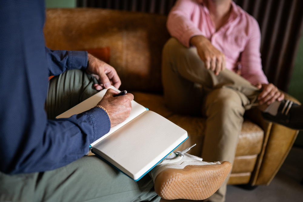 Working session — taking notes in a notebook